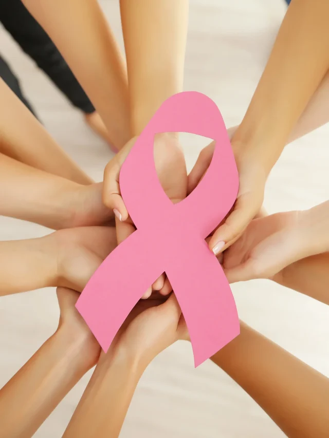 women-hands-joined-circle-holding-breast-cancer-symbol